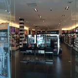 Looking inside a cosmetics store at the display showing multiple choices of beauty products.